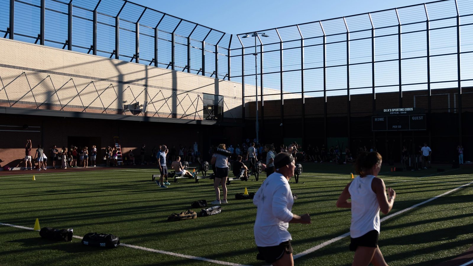 Athletes running the track at the HYROX Simulation, Dick's House of Sport